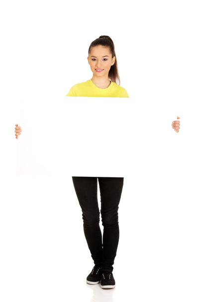 Young happy woman with blank board. - Φωτογραφία, εικόνα