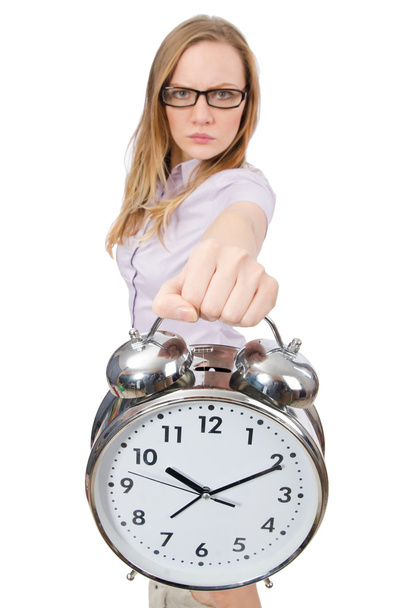 Young employee holding alarm clock isolated on white - Photo, image