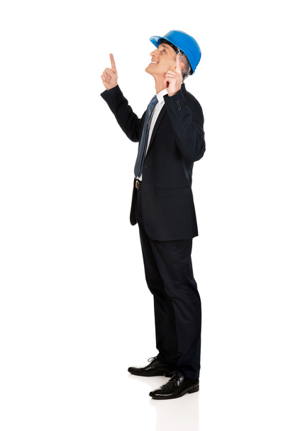 Businessman engineer pointing up - Photo, image