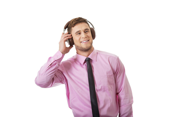 Young businessman listening to music. - Fotografie, Obrázek