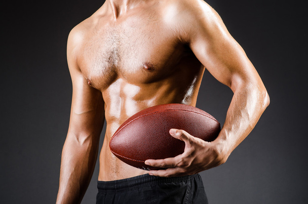Muscular football player - Foto, afbeelding