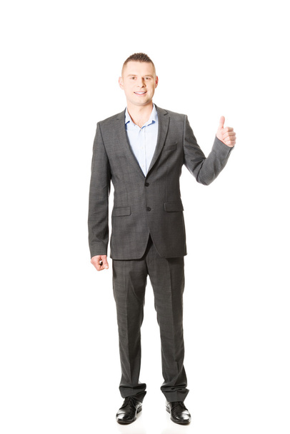 Young businessman gesturing ok sign - Foto, afbeelding