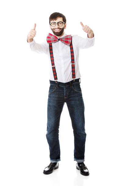 Man wearing suspenders with thumbs up. - Valokuva, kuva