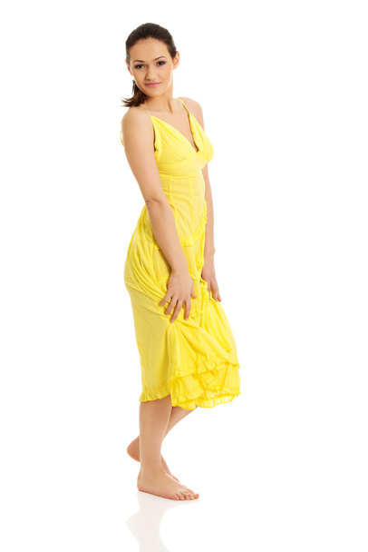 Woman in yellow dress. - 写真・画像