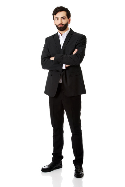 Smiling businessman with folded arms. - Foto, imagen