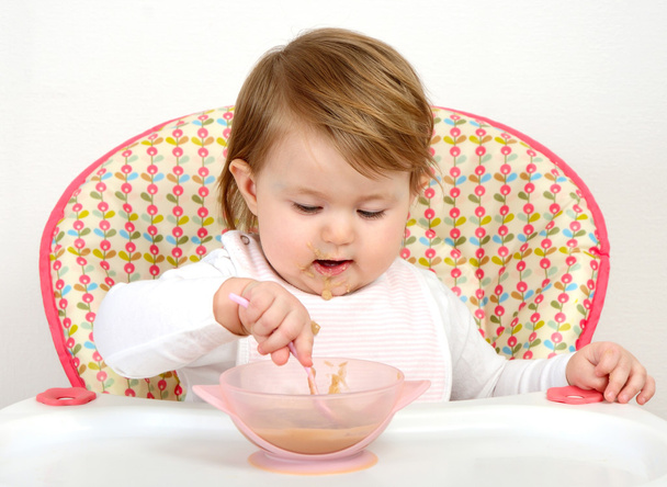 portrait of cute baby eating - Foto, immagini