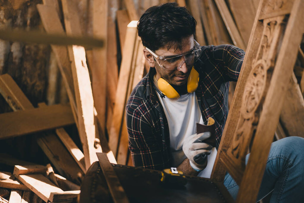 professional carpenter man hand working make wooden handcraft furniture master workpiece fine detail artisan with wood workshop. - Photo, Image