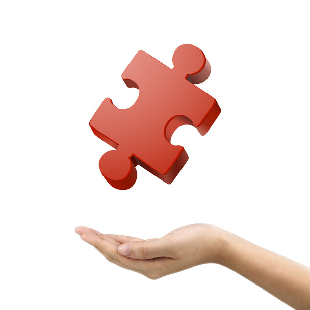 businessman's hand holding jigsaw puzzle piece  - Photo, Image