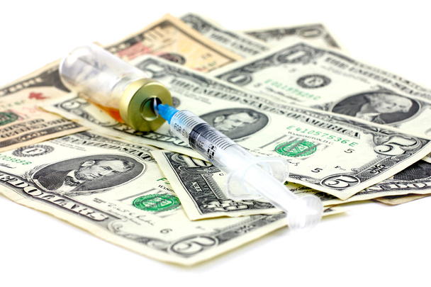 Syringe, ampoule and dollars - Foto, Imagen