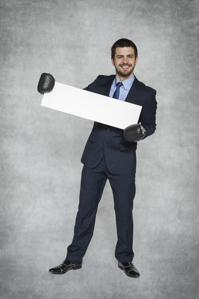 businessman with a piece of paper perfect for advertisement - Foto, Bild