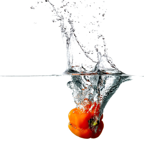 Pepper drops into a water - Zdjęcie, obraz