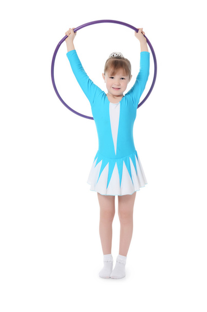 Little girl gymnast holding hoop - Fotoğraf, Görsel