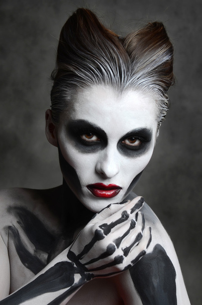 woman with skull face art - Photo, image