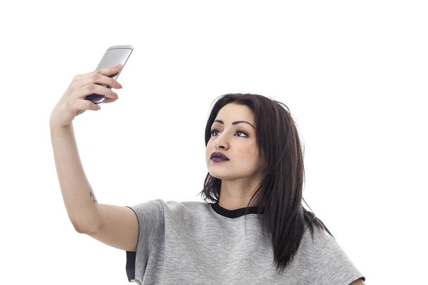 Beautiful woman taking a selfie - Zdjęcie, obraz