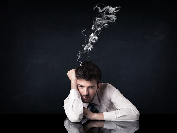 Depressed businessman with smoking head - Photo, Image