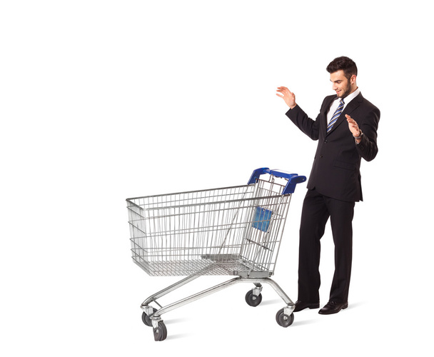 Businessman with shopping cart - Foto, Imagen