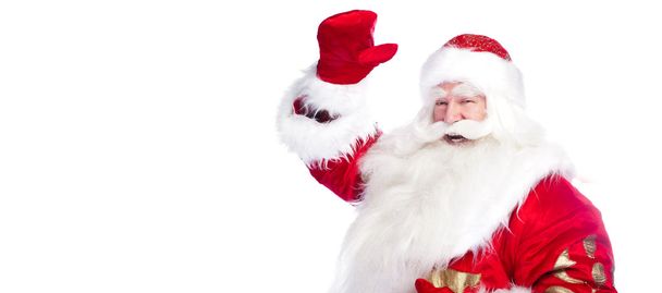 Санта Клаус указывает рукой изолированы над белым
. - Фото, изображение
