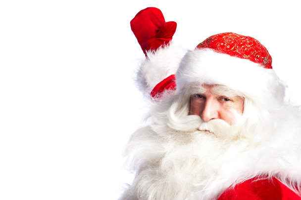 Santa Claus pointing his hand isolated over white. - Photo, image
