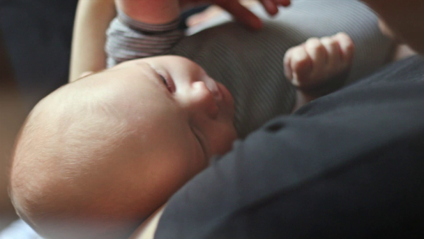 Young mother holding her baby - Filmagem, Vídeo