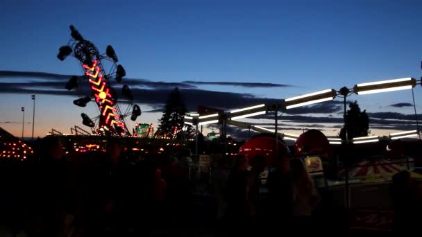 Carnival rides in an amusement park - Felvétel, videó