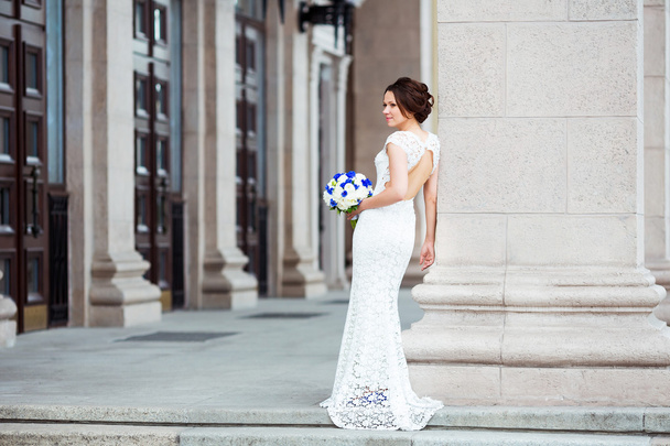 Elegant bride with wedding bouquet - Фото, зображення