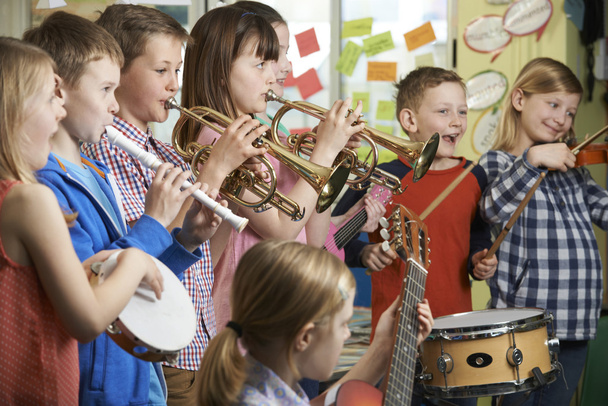 Group Of Students Playing In School Orchestra Together - Foto, imagen