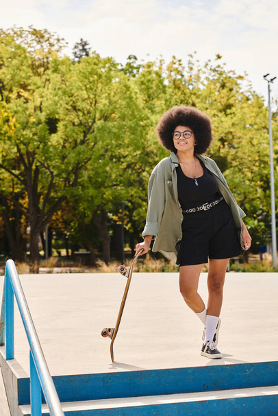 A stylish young woman with an afro confidently climbs a flight of stairs, showcasing her unique hairstyle and bold attitude. - Photo, Image