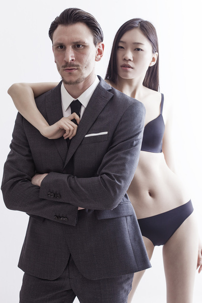 Businessman portrait with beautiful chinese model - 写真・画像