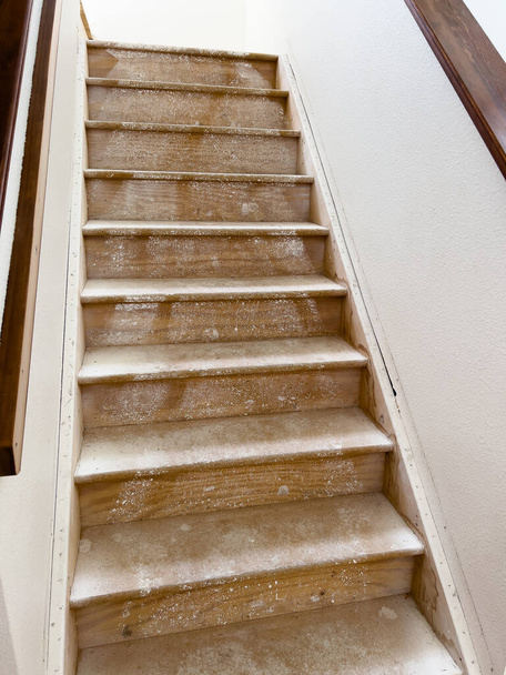 Captured in the midst of a home remodeling project, this staircase is prepared for new flooring, symbolizing a transition and the promise of renewal. - Photo, Image