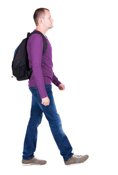 Walking  man  with backpack. - Foto, afbeelding