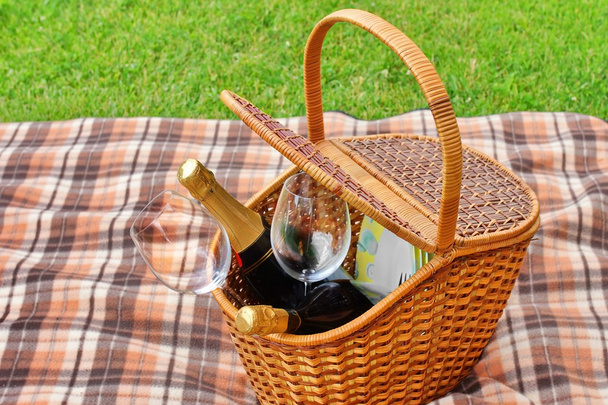 Picnic Basket On The Blanket Close-up. Lawn On The Background - Photo, Image