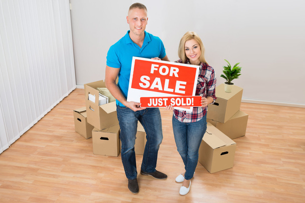 Couple Holding Sold Sign - Photo, Image