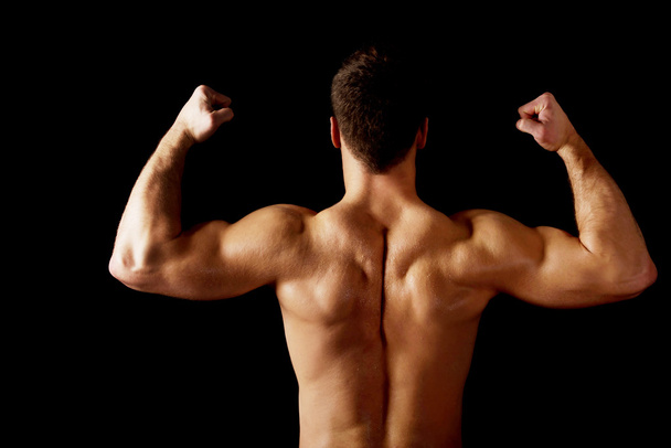 Sexy man showing his muscular back. - Fotografie, Obrázek