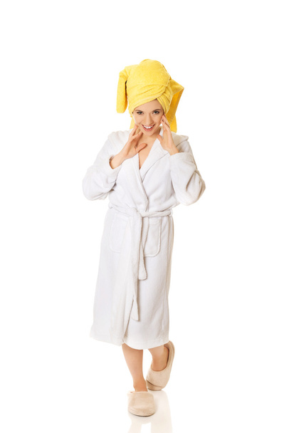 Smiling woman in bathrobe - Фото, зображення