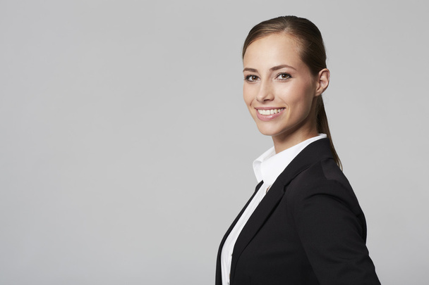 Young businesswoman smiling - Fotoğraf, Görsel