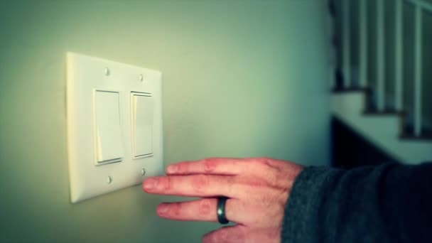 Hand turns on light switch - Кадры, видео