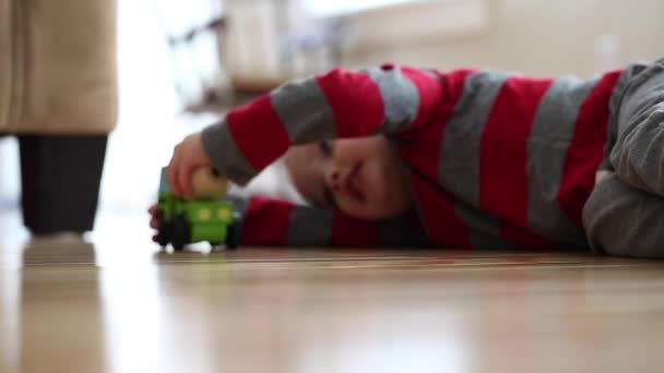 Boy plays with his toy - Felvétel, videó