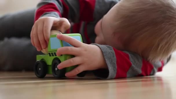 Boy plays with his toy - Materiał filmowy, wideo