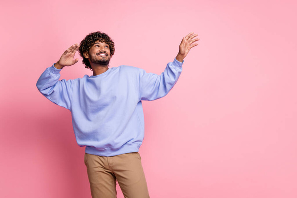 Photo of optimistic glad man wear stylish outfit look up interesting news recommendation empty space isolated on pink color background. - 写真・画像