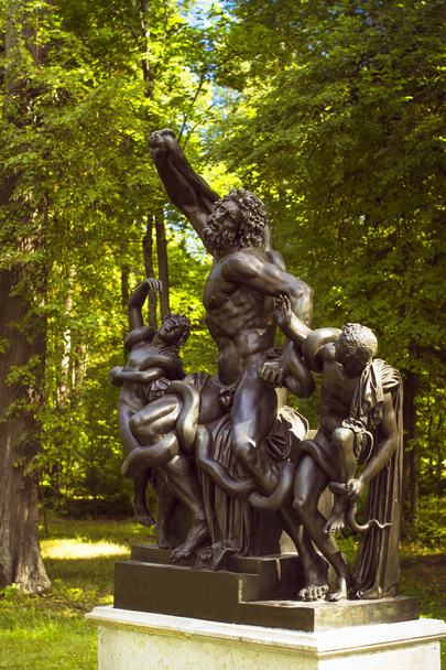Bronze sculpture nude men with a snake in Oranienbaum - Photo, Image