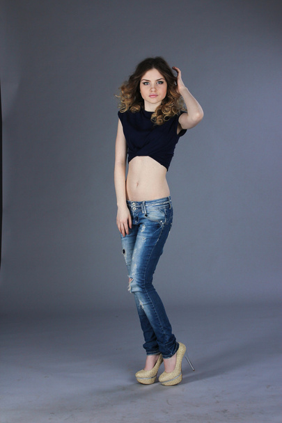 Girl in torn jeans - Foto, Imagen