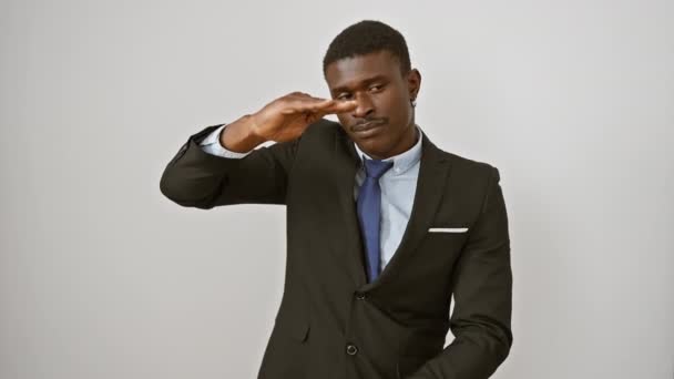 Cheerful african american man in a suit standing, gesturing with hands, showing a large size symbol. demonstrating big measure concept isolated on a white background. - Footage, Video