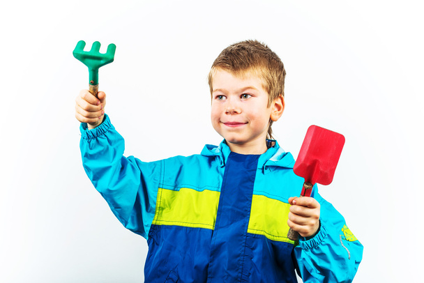 Happy spring gardening boy with shovel and rake - Photo, Image