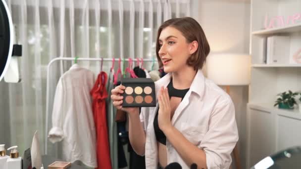 Woman influencer shoot live streaming vlog video review makeup prim social media or blog. Happy young girl with cosmetics studio lighting for marketing recording session broadcasting online. - Footage, Video