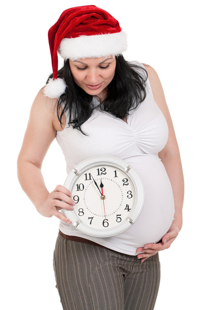 zwanger vrouw met klok - Foto, afbeelding