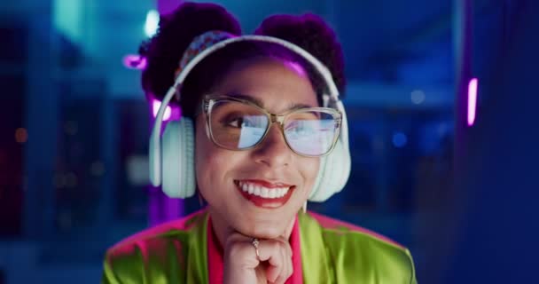 Neon, smile and woman with headphones, listening to audio and streaming music with internet. Person, home and lights with girl and headset for sound or radio with podcast and creative with confidence. - Footage, Video