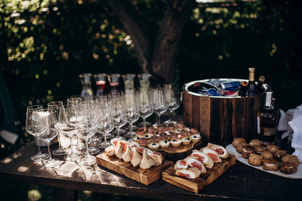 Cold drinks, alcoholic and non-alcoholic drinks and canaps on the buffet. Catering, service, aperitif. Celebration, event under the open sky outside - Photo, Image