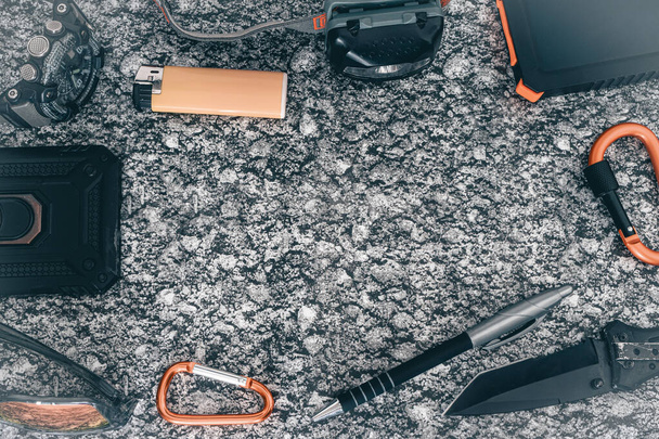 Flat lay of some Outdoor/EDC gear on a grey background. - Photo, Image