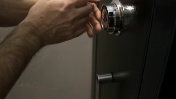 Man unlocking a safe - Кадри, відео