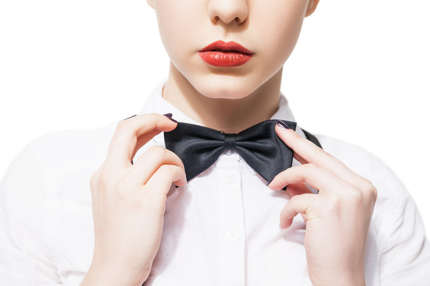 Close up portrait of  young woman in white shirt and bow tie with red lipstick - Foto, Imagen